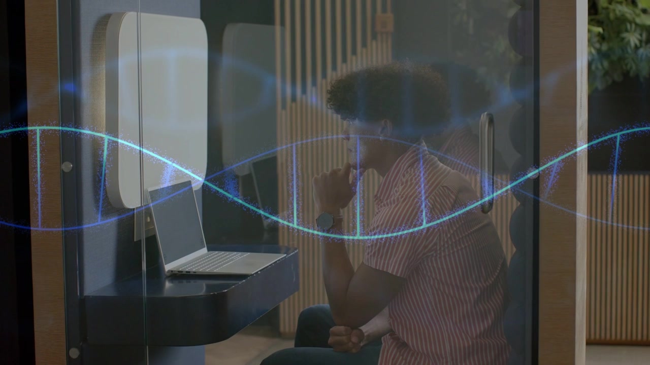 Adult male sitting in pod, viewing laptop for tech while blue waveform sweeping glass driving focus