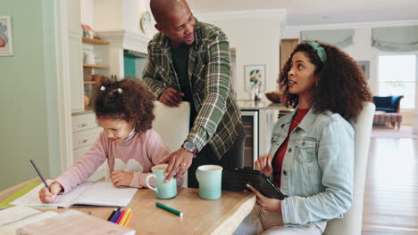 family at home using tablet and doing schoolwork