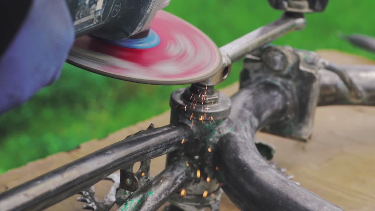 Metal grinding machine making sparks from the metal