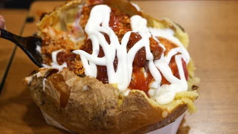 stuffed baked potato with sauces