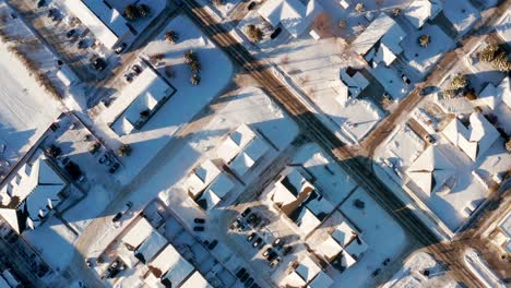 a quiet sunny afternoon in snowy small town streets