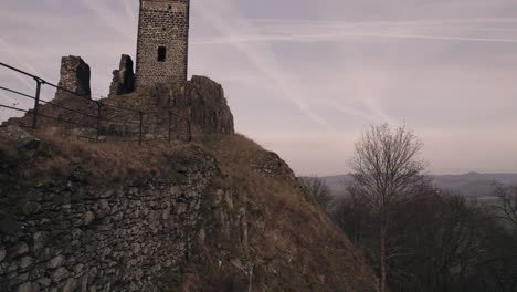 Low-level-drone-view,-ruins-of-medieval-castle-walls-and-hilltop-fortification
