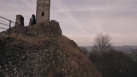 low level drone view, ruins of medieval castle walls and hilltop fortification