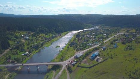 aerial view of a river valley village in summer