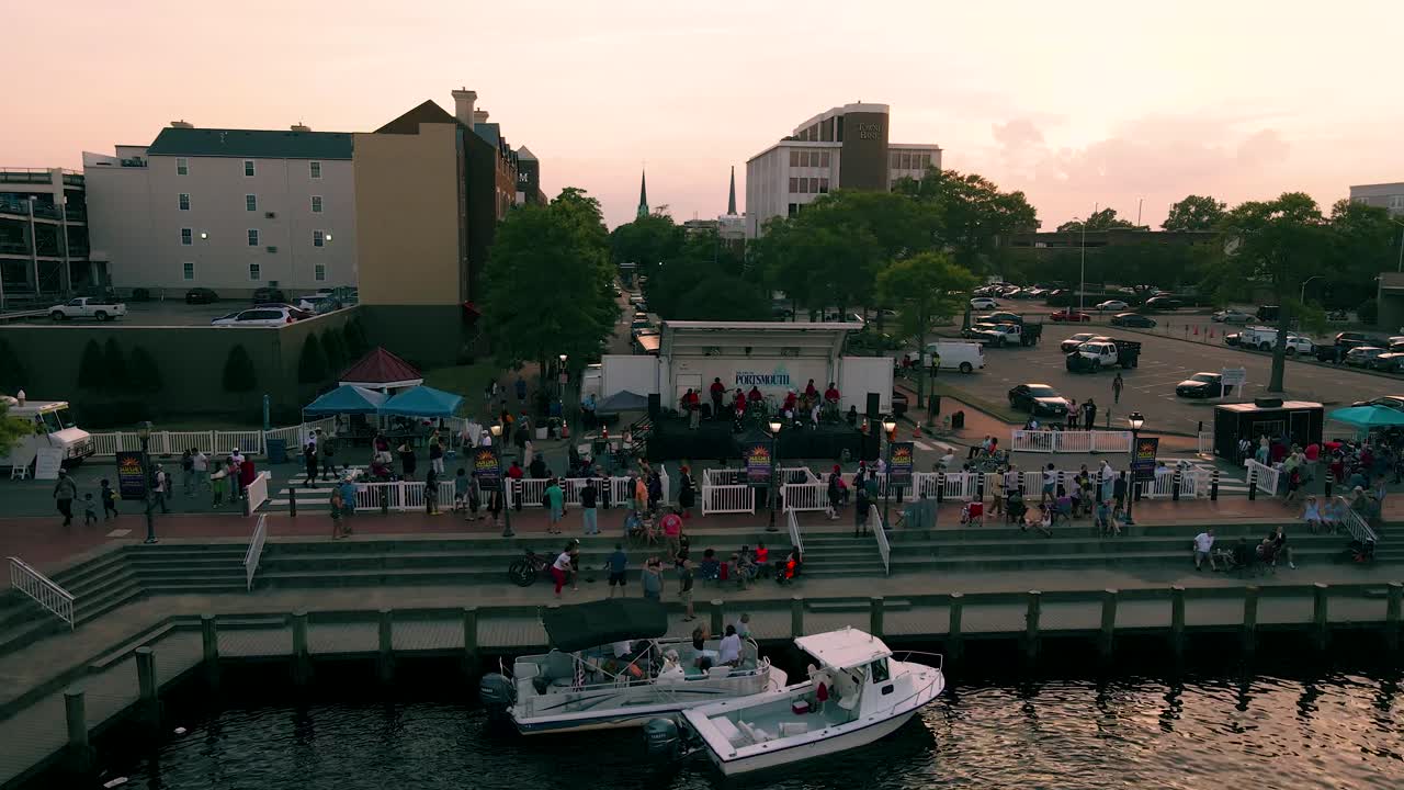Aerial View Of Busy Promenade During Evening Sunset In Norfolk, Virginia. Parallax Shot