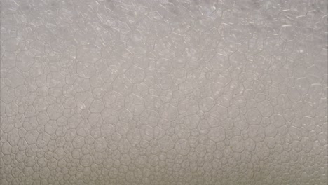 Timelapse-of-foam-bubbles,-super-macro-closeup