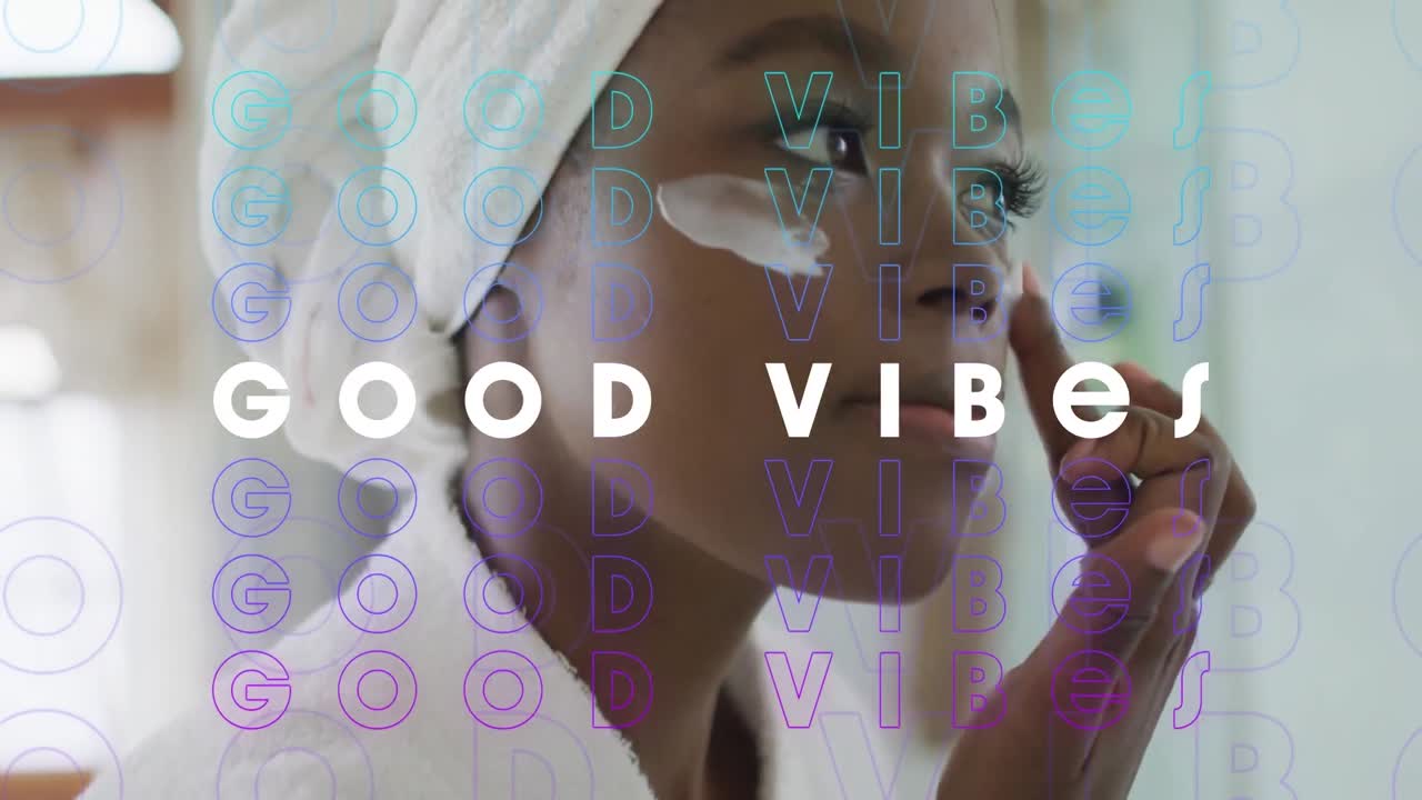 Animation of good vibes text over african american woman using cream in bathroom