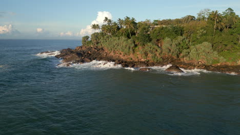 Rising-Establishing-Aerial-Drone-Shot-of-Waves-Crashing-Against-Rocky-Tropical-Coastline-in-Southern-Sri-Lanka