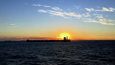 A-static-shot-of-Cargo-ship-on-sea-in-the-rays-of-sun