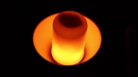 luminous flame bulb illuminated at black background