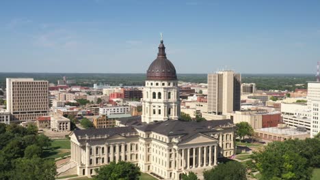 kansas state capitol building in topeka, kansas with close up drone video pulling out at an angle