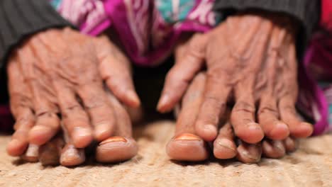 elderly person's hands and feet