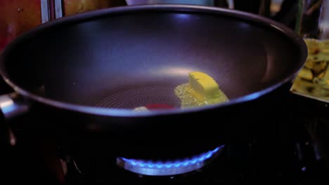 butter melting in pan on gas stove