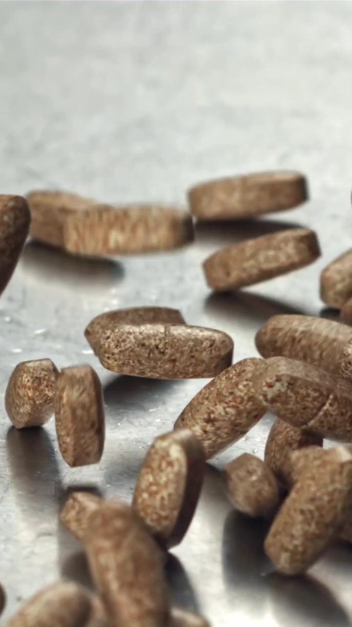 Brown Pills Falling and Bouncing on a Metallic Surface in Slow Motion