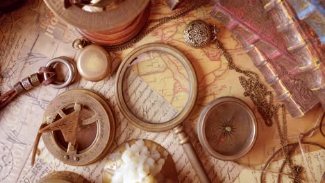 vintage style travel and adventure. vintage old compass and other vintage items on the table.