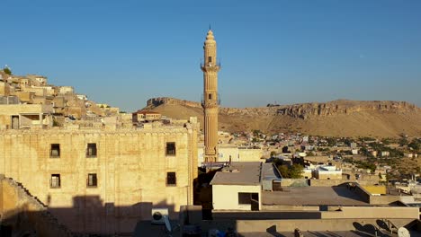 sehidiye mosque and its minaret with old mardin cityscape, mardin, turkey