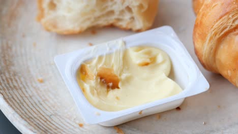 Fresh-baked-croissant-and-butter-on-plate