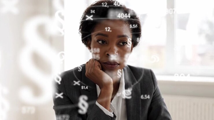 Thought-Provoking Moments: A Professional Woman Reflects on Financial Data and Overarching Decisions in a Modern Work Environment