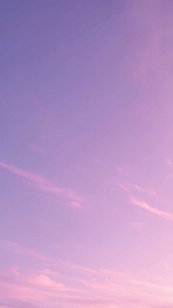 Pastel Purple and Pink Gradient Sky with Faint Clouds