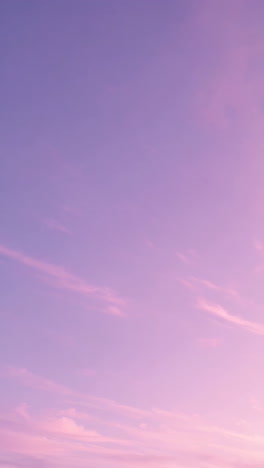 pastel purple and pink gradient sky with faint clouds