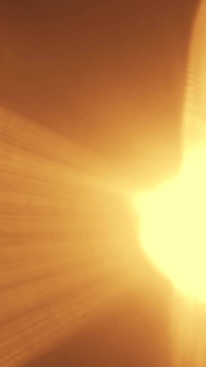 Abstract Golden Light Leaks and Lens Flares on Dark Background