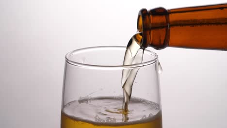 Beer Being Poured Into Translucent Glass, Slow Motion