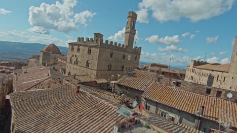 fast aerial over the walled town of volterra, province of pisa, italy