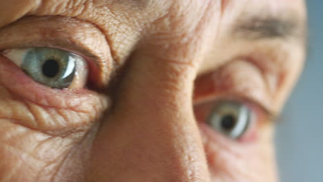 eyes of elderly senior woman with poor mental