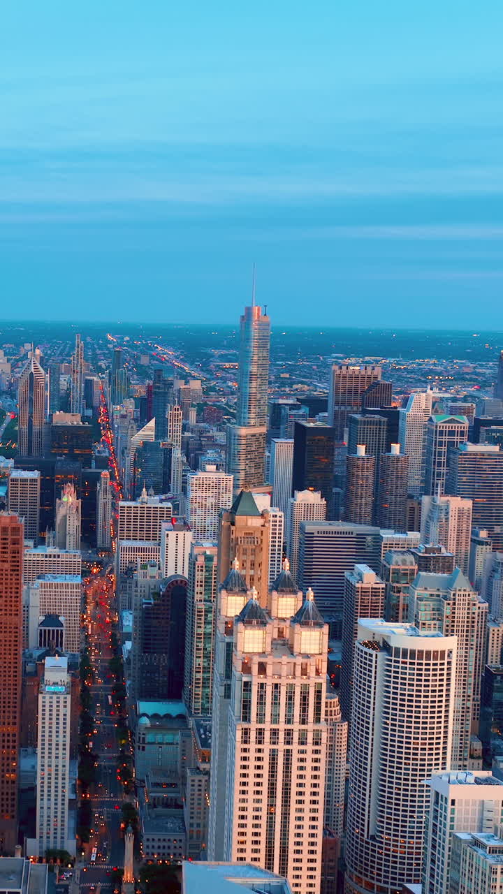 City of Chicago. Aerial view of Chicago downtown at sunset from high above. Blue sky. Vertical video