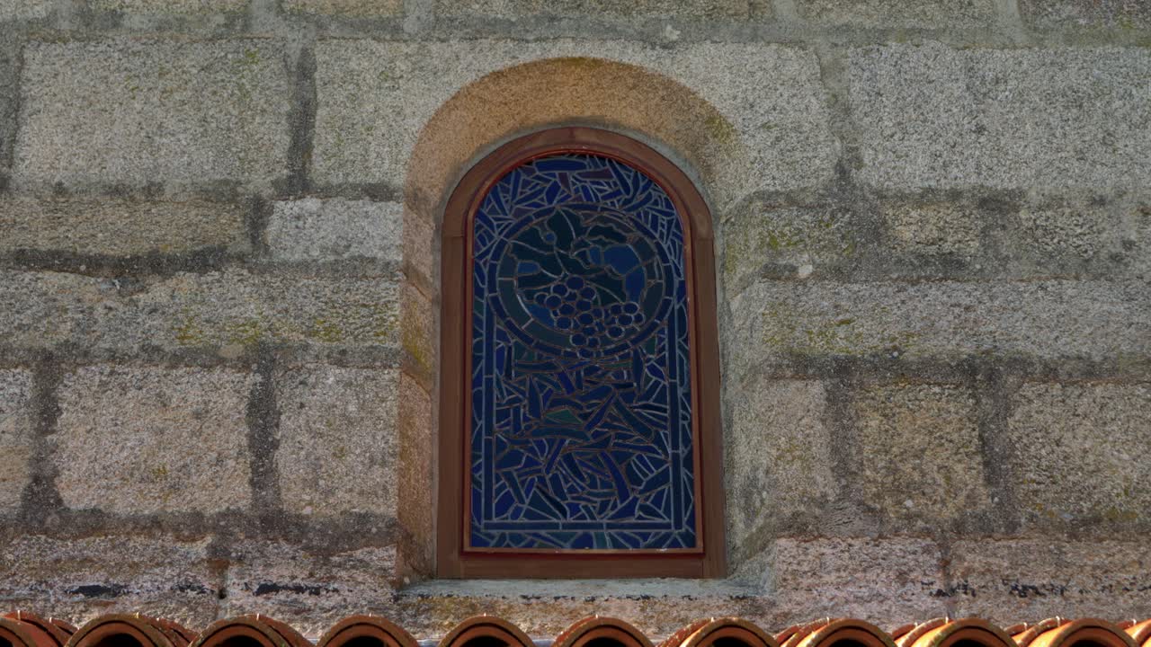 Stained Glass Window in a Stone Wall