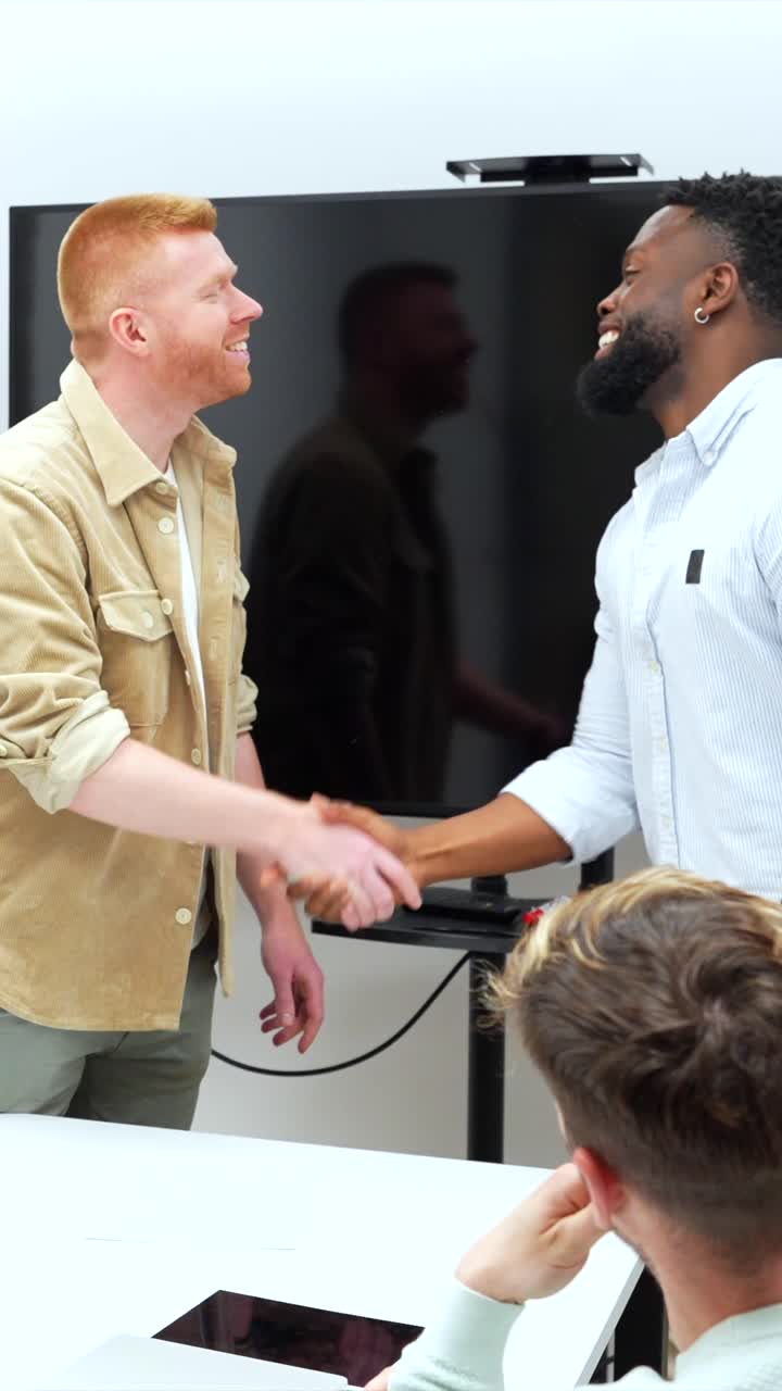 Business handshake in an office setting