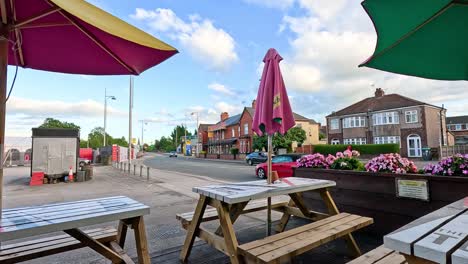 colorful umbrellas and tables in a street setting