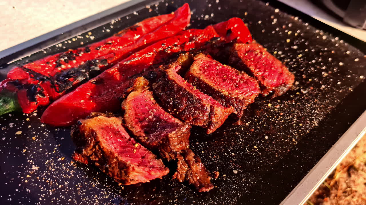 Grilled steak with peppers in Jelgava, Latvia on a hot plate