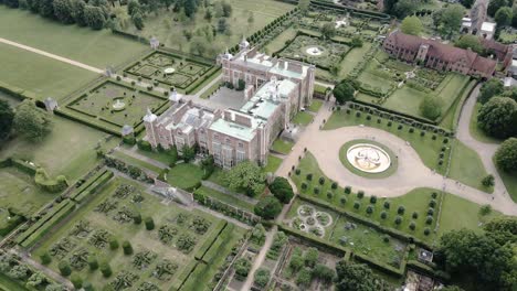 Aerial-view-above-Hatfield-house-historic-Tudor-park-and-landscaped-gardens-landmark