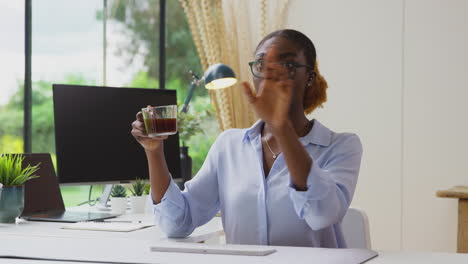 Woman-Working-From-Home-Office-At-Desk-Interacting-With-AR-Technology