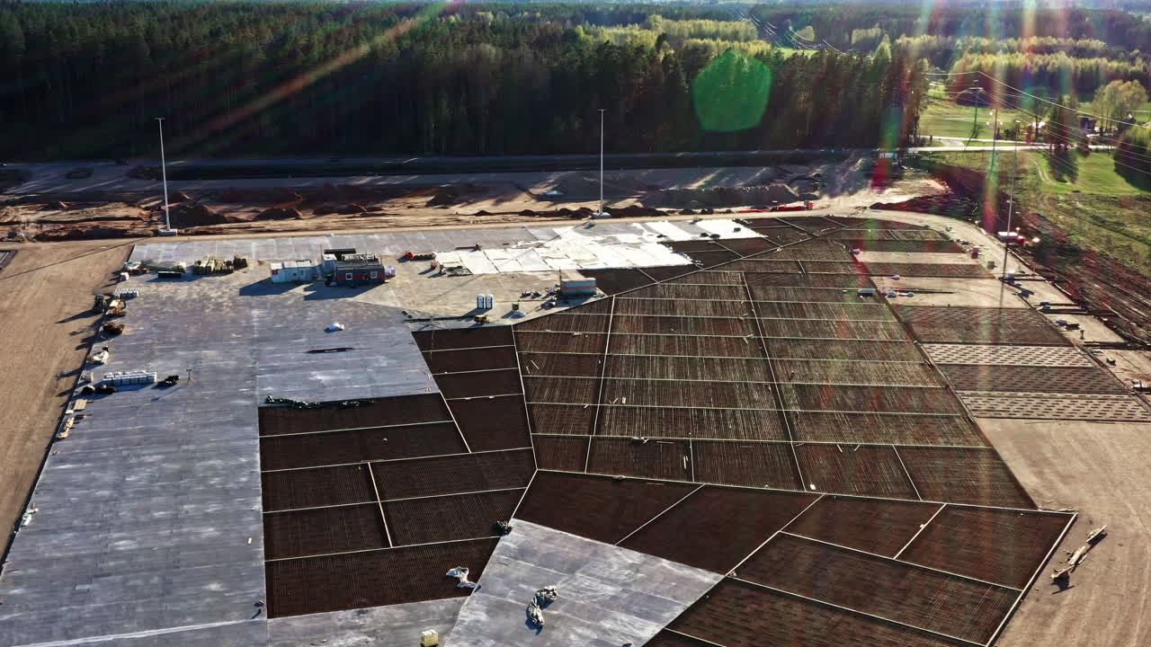 Industrial Concrete Groundwork and Rebar Mesh at Large Site in Sunny Forest Area from Above