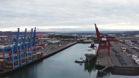 port of tacoma on a cloudy day in tacoma, washington - aerial pullback