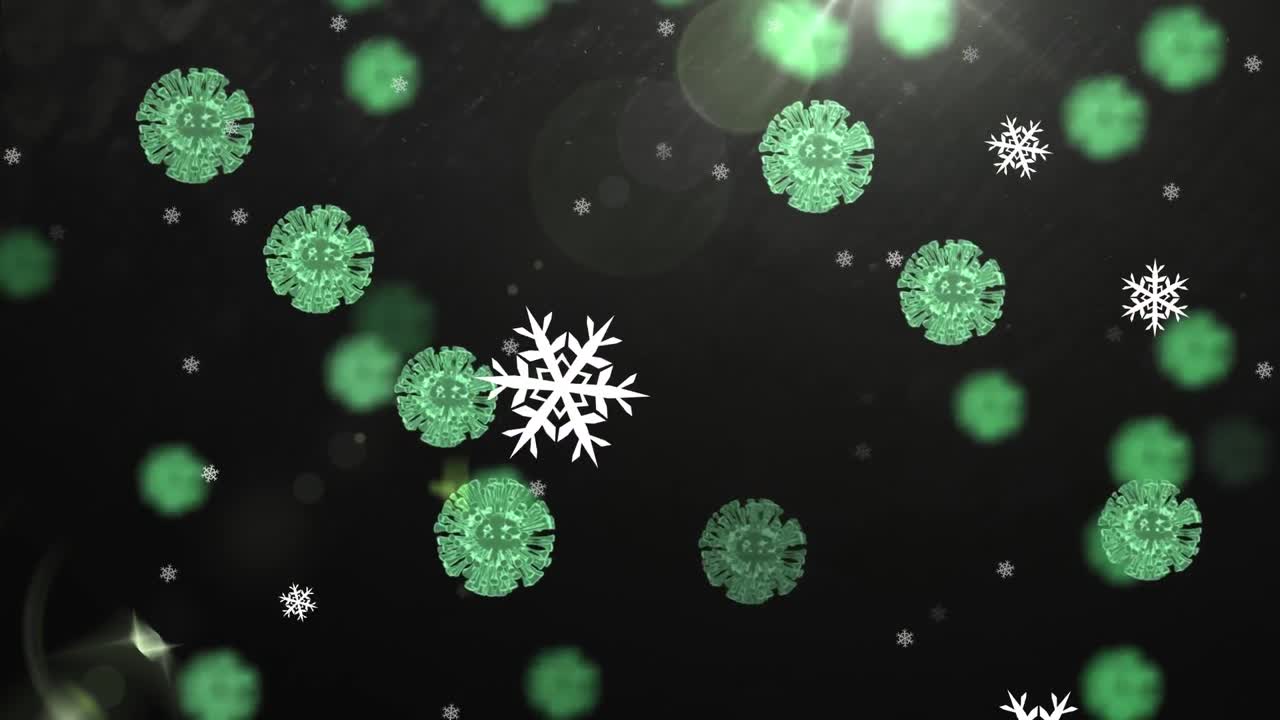 黒い背景に雪が降る冬景色の上を、緑色のCOVID-19細胞が動くアニメーション