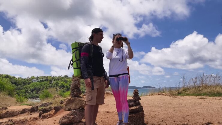 Couple Hiking and Exploring a Coastal Trail