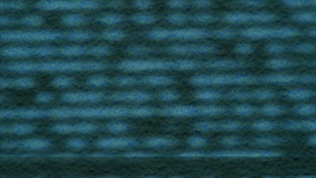 A retro TV displaying static noise, creating a nostalgic vintage atmosphere with blue and green hues.