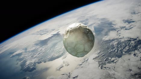 old soccer ball in space on earth orbit