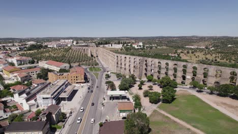 Establishing-aerial-drone-view-of-Amoreira-Aqueduct-in-Elvas,-Portugal,-day