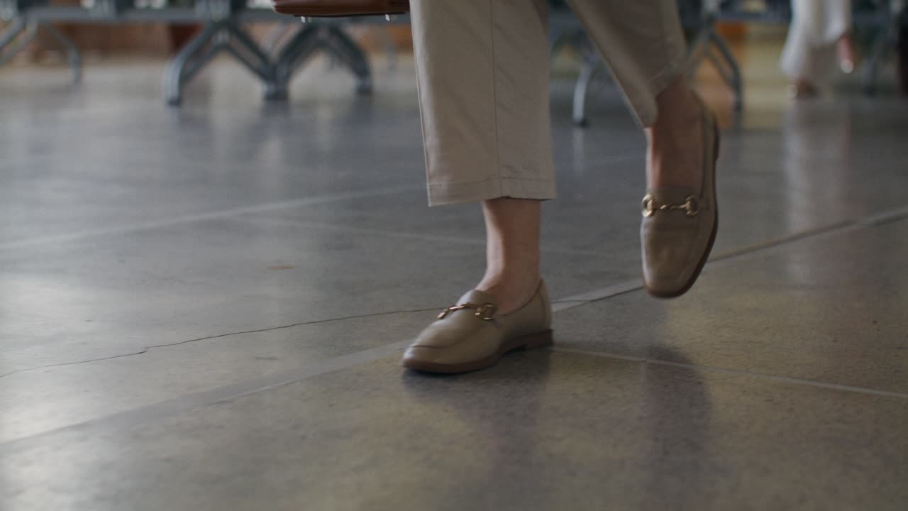 Person Walking in Waiting Area