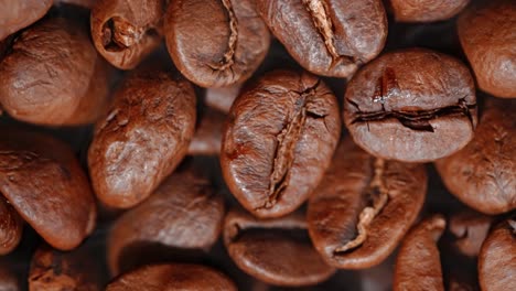 close up of seeds of coffee. fragrant coffee beans are roasted smoke comes from coffee beans.