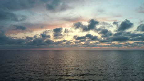 dron flying over sea in a beautiful sunset