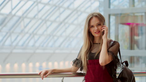 happy female shopper talking on the phone and smiling