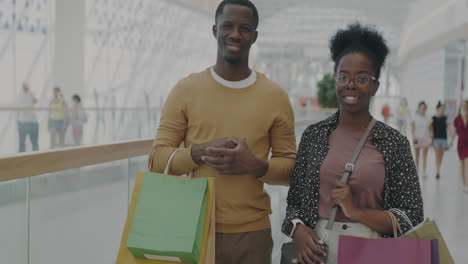 happy couple shopping at the mall