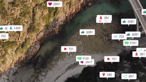 animation of social media icons over shore and sea landscape