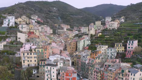 Aerial-view-of-Riomaggiore,-Cinque-Terre,-during-a-sea-storm