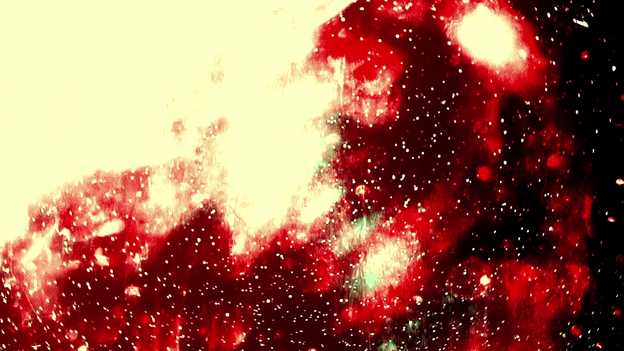 黒背景で動く抽象的な赤と緑の光の粒子